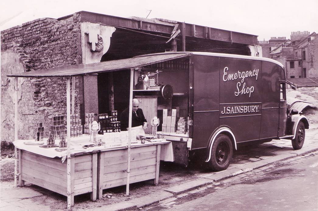 An emergency shop 
A Sainsbury's emergency shop set up outside a bombed building. It was one of two vans used to serve customers when a Sainsbury's branch was unable to trade normally following bombing. (ID no.: SA/WAR/2/IMA/1/10)
