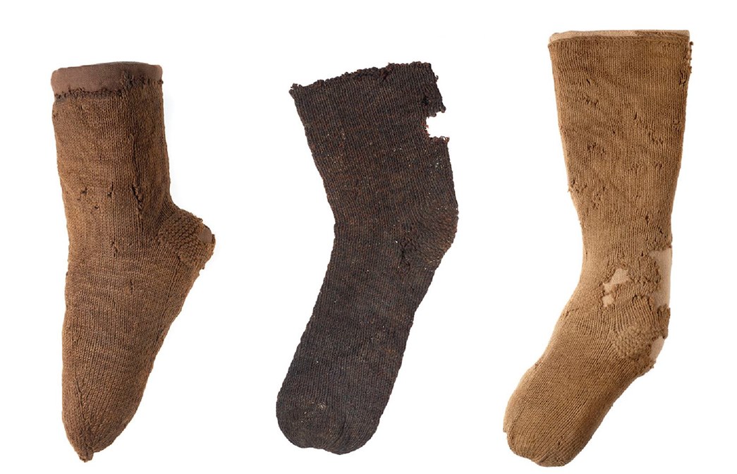 Examples of 16th century knitted socks with strengthening at the heel. (ID no.: 22403, 22402, 22401)