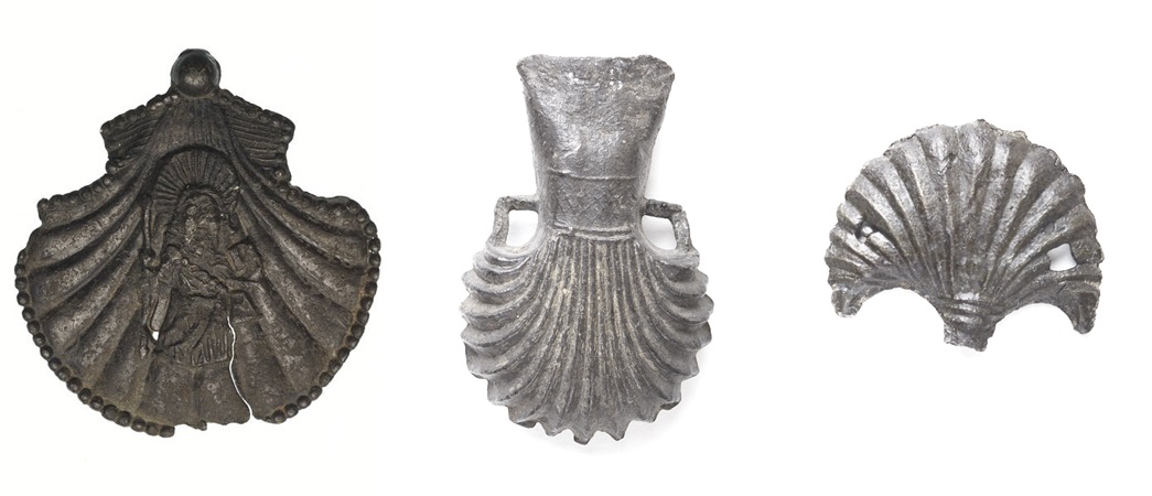 Medieval pilgrim shell-shaped tokens
These pins and ampulla from the museum’s collection are some surviving examples of scallop shell-shaped pilgrim tokens. The first one has St James engraved on it. (ID nos.: 85.79/3, 8818, 82.221/18)
